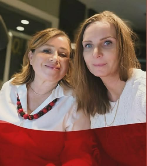 Hosts of What's Up Windsor with the Polish flag